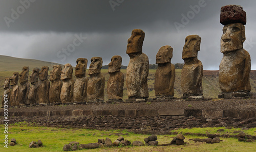 Moai statues against a cloudy sky, Easter Island, Chile photo