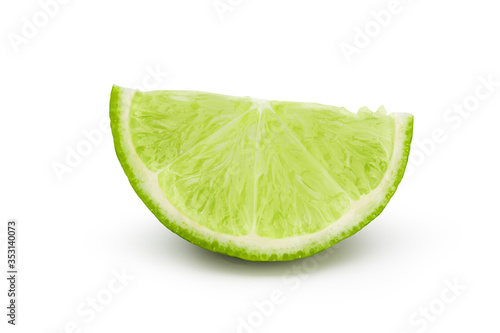 Lime slice into pieces with drop shadow on white background. Commercial image of citrus fruits isolated with clipping path.