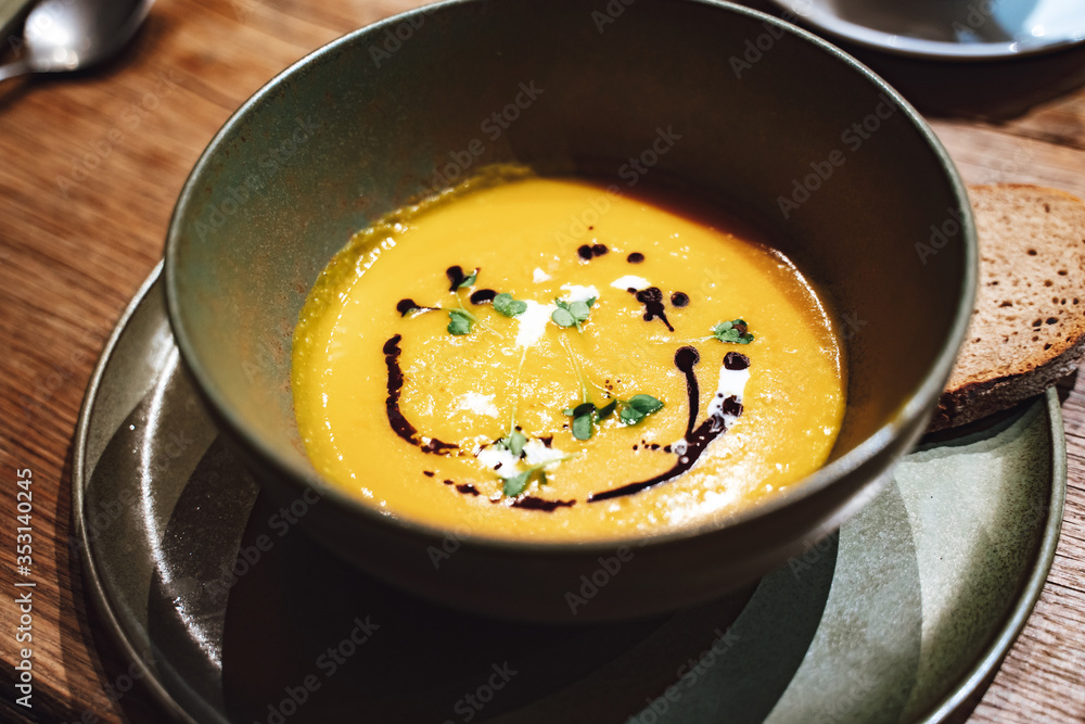Creamy pumpkin soup drizzled with soy sauce Creamy pumpkin soup drizzled with soy sauce