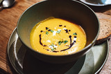 Creamy pumpkin soup drizzled with soy sauce