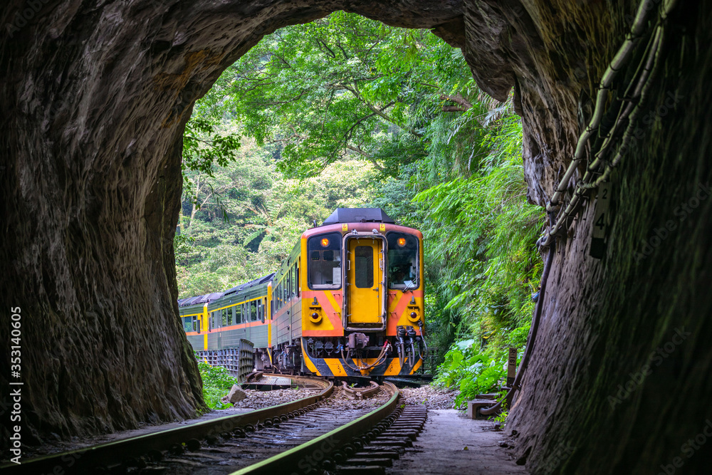 Train with Tunnel of Pingxi Line, Taiwan - Single-track railway branch line of the Taiwan Railway Administration, shot in Pingxi District, New Taipei, Taiwan.