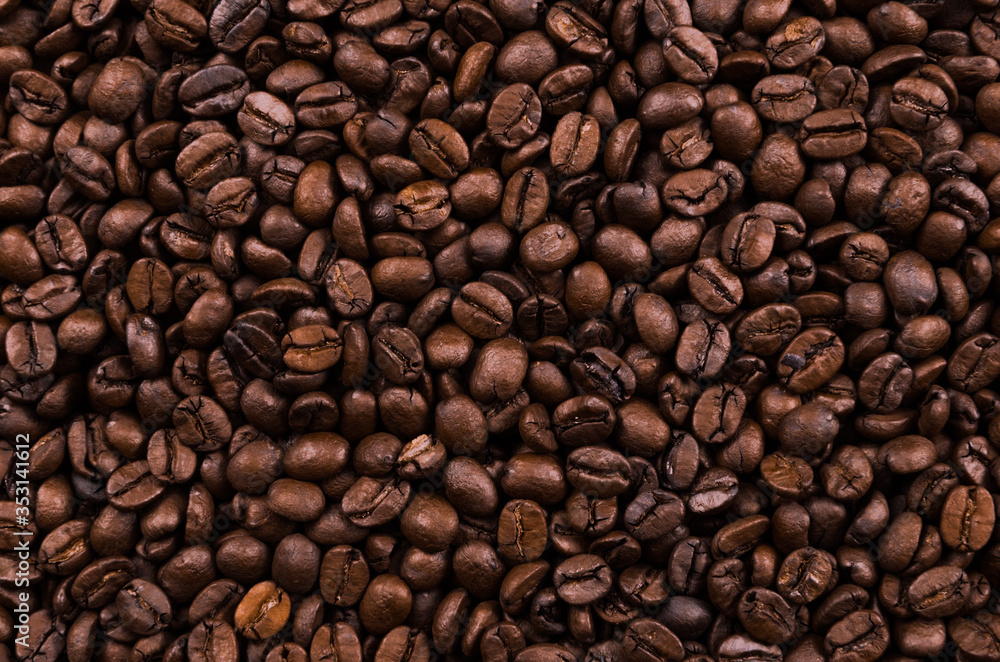 Texture, background of whole coffee beans, raw.