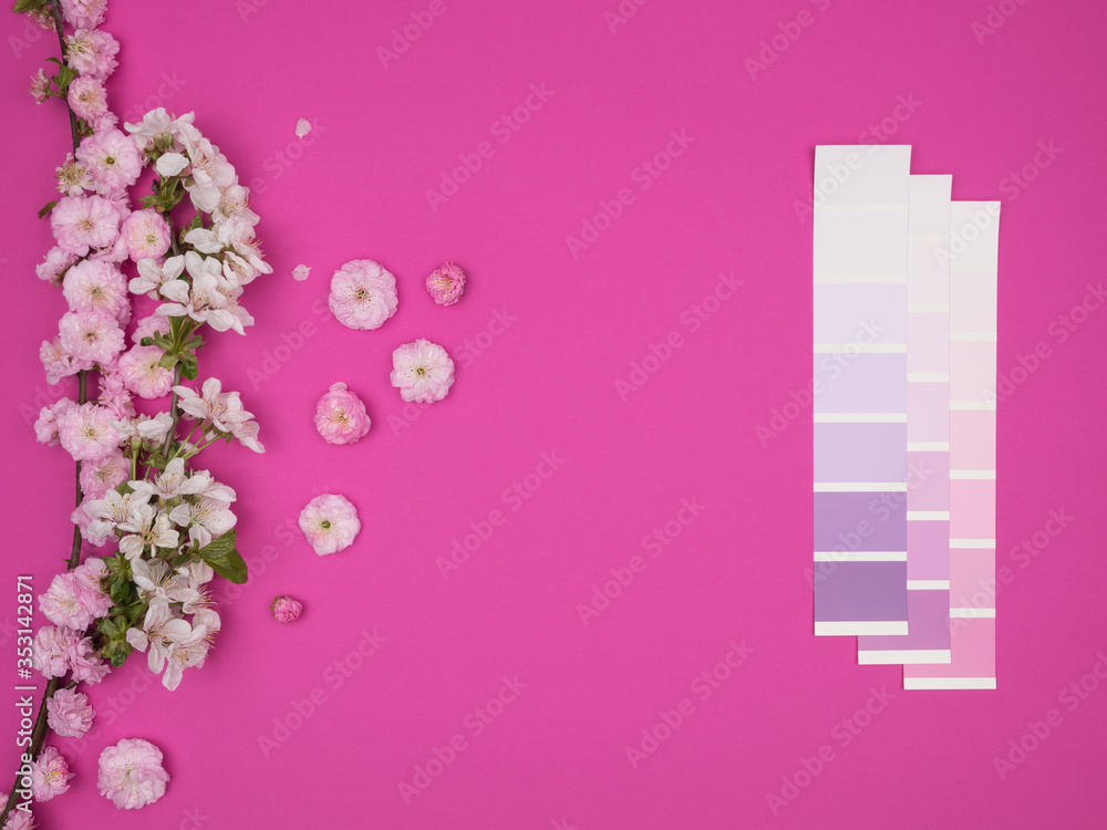 The blossoming branch of the almondist is decorative and the color palette on a pink background. The blossoming branch of the almondist is decorative and the color palette on a pink background.