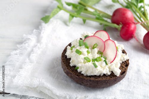 Curd sandwiches with fresh herbs. Fresh rye bread with cottage cheese and green herbs.