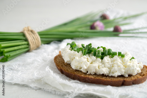 Curd sandwiches with fresh herbs. Fresh rye bread with cottage cheese and green herbs.