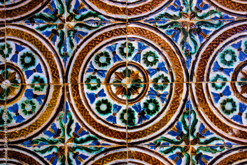 Traditional tiled wall decoration in a city palace in Seville, Spain 