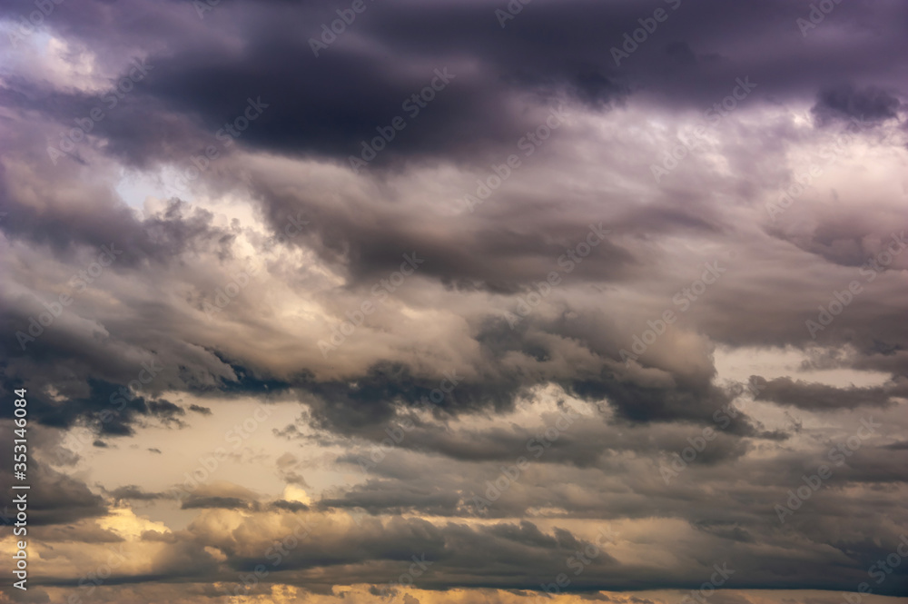Natural sky composition. Dark ominous colorful storm rain clouds. Dramatic sky. Overcast stormy cloudscape. Thunderstorm. Element of apocalypse design.