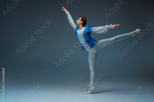 Φωτογραφία Young and graceful ballet dancer as Cindrella's Prince on white studio background