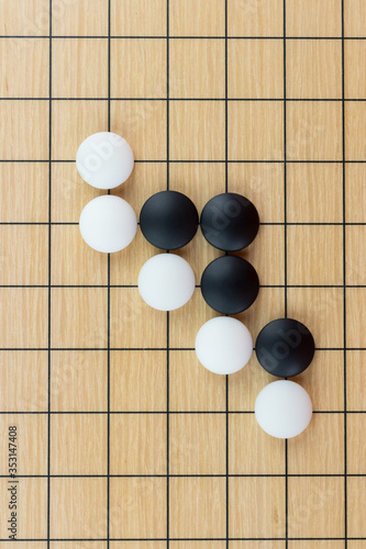 Simple training position of black and white stones on the playing field  gohan  of Chinese game go