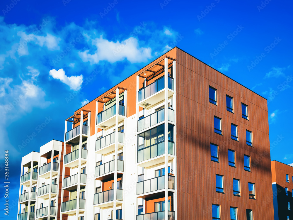 Modern new apartment house copy space blue sky clouds_4x3