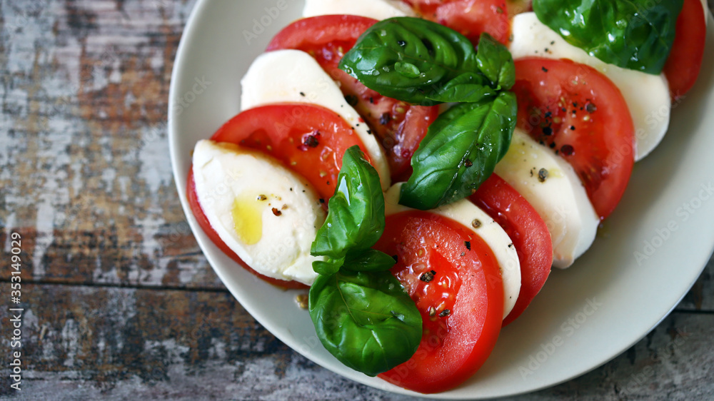 Selective focus. Italian caprese salad. Cooking at home. Selective focus. Italian caprese salad. Cooking at home.
