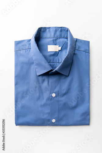 New Blue Men's shirts Folded on white background,