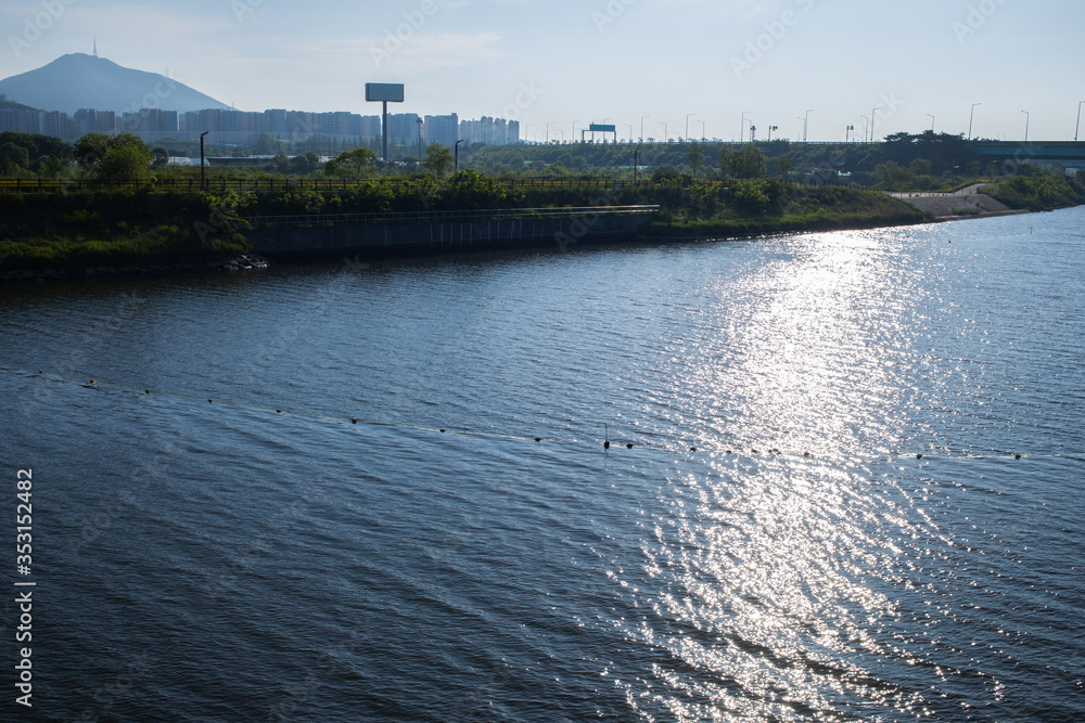the sun's rays on the calm river the sun's rays on the calm river