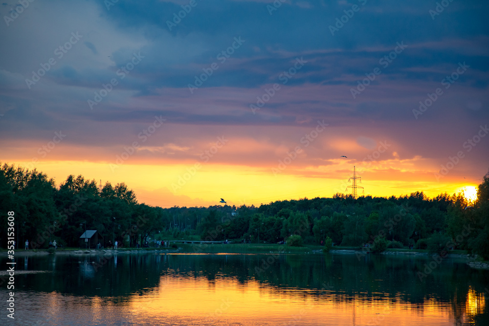 Bright orange sunset over the pond