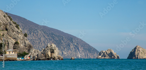 Adalary rocks-twin rocks on the coast of Gurzuf in bright Sunny weather and clear blue sky photo