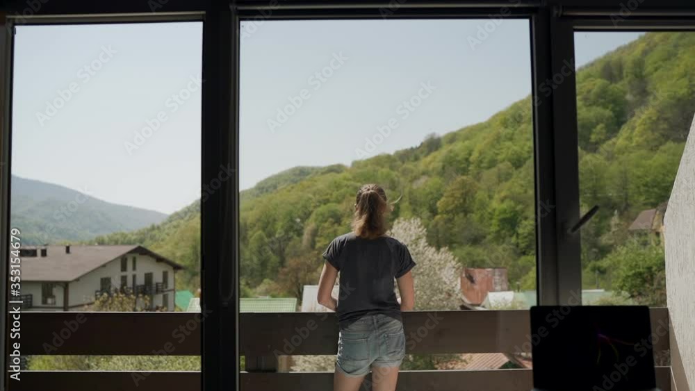 Young woman on a balcony. Stay at home Young woman on a balcony. Stay at home