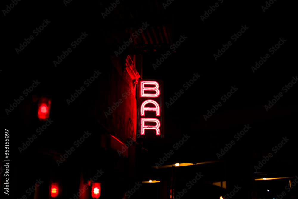 Bar neon sign on the wall in the night Bar neon sign on the wall in the night