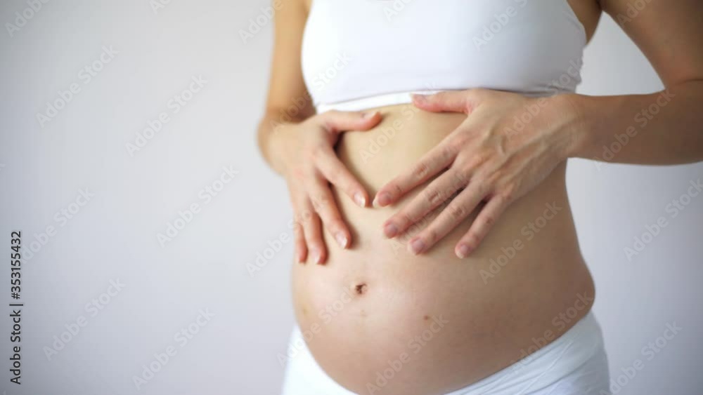 4K Asian Chinese Pregnant Woman holding touching her belly 4K Asian Chinese Pregnant Woman holding touching her belly