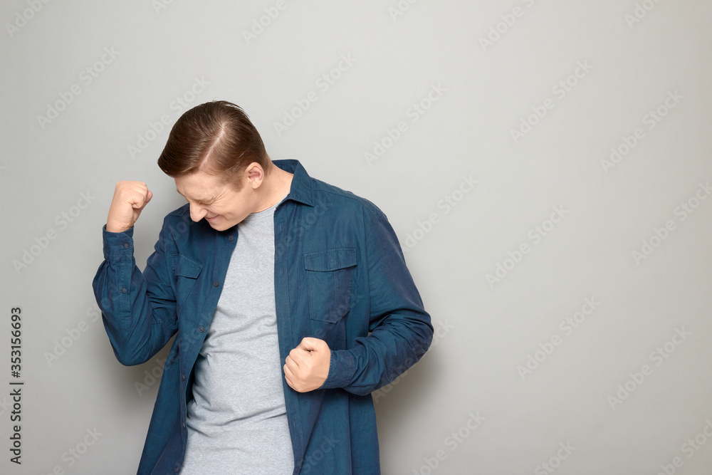 Portrait of happy man saying yes and rejoicing at successful deal