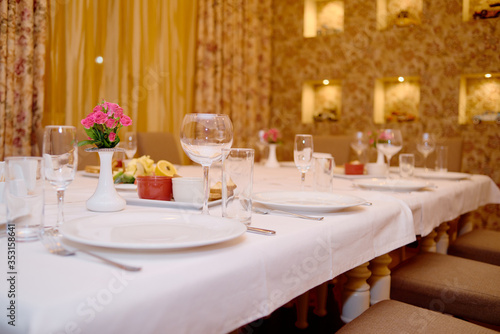 Holiday dinner table served for banquet in restaurant  copy space