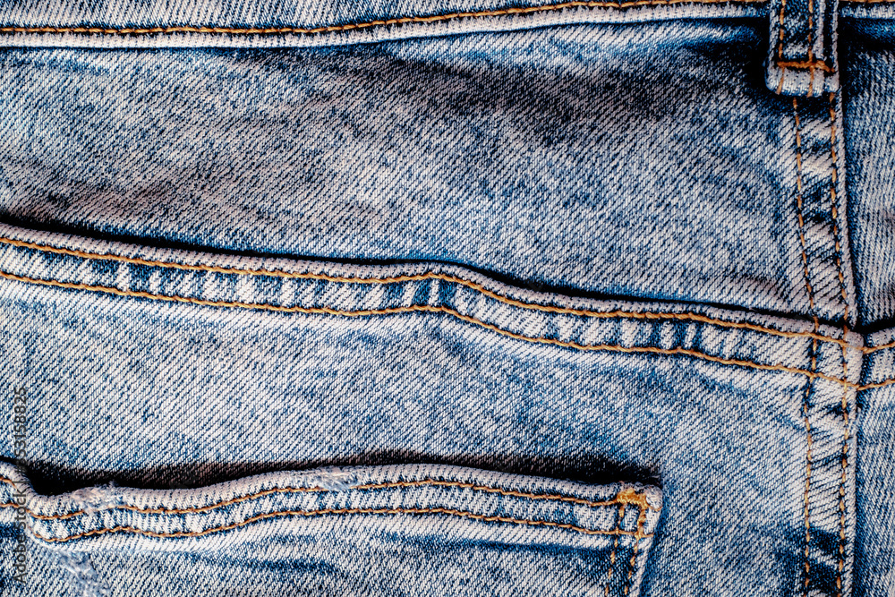 Details from jeans pants with seams and pockets Details from jeans pants with seams and pockets