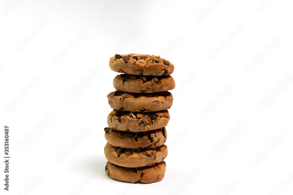Column of a baked chocolate cookies with a white background Column of a baked chocolate cookies with a white background
