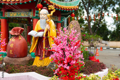 Chinese temple. The statue of the old sage  in the Chinese style. Chinese religion