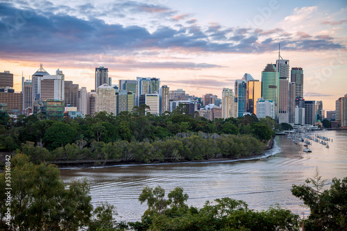 The Brisbane River flows through downtown Brisbane at dusk on a beautiful evening.