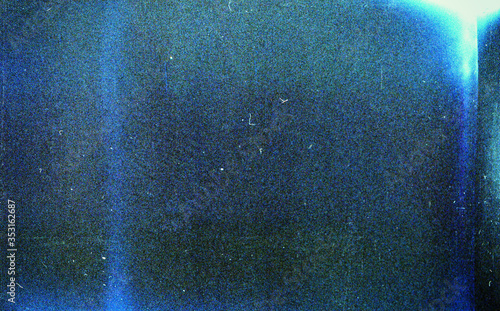 Fotografie, Obraz Noisy blue film frame with scratches, dust and grain