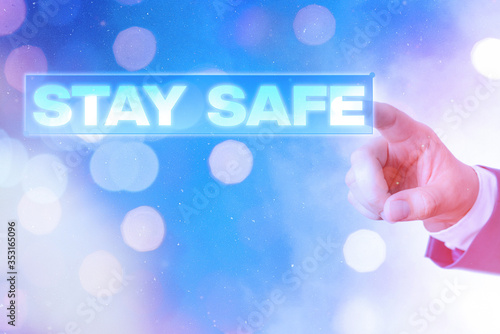 Writing note showing Stay Safe. Business concept for secure from threat of danger, harm or place to keep articles photo