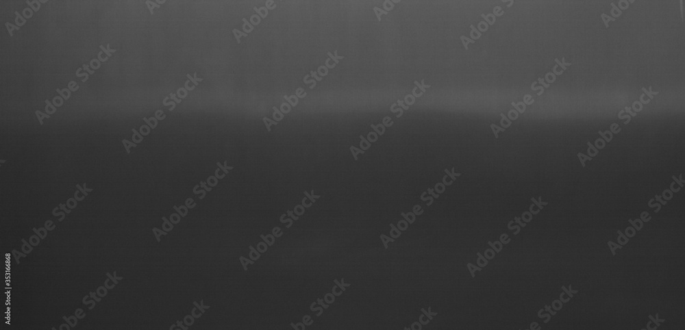 The background image of the dark colored concrete wall has light from the top of the picture. There is space for designing and inserting advertisements.