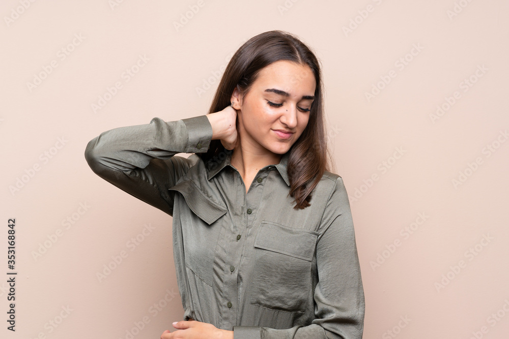 Young girl over isolated background with neckache Young girl over isolated background with neckache