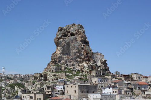 The Uchisar Castle rises up over the Cappadocia.