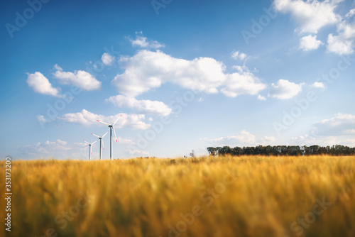 Three wind turbines on a field in the village of Karle (Svitavy district). photo