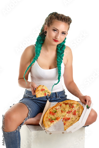 white girl with green dreadlocks eats pizza green dreadlocks