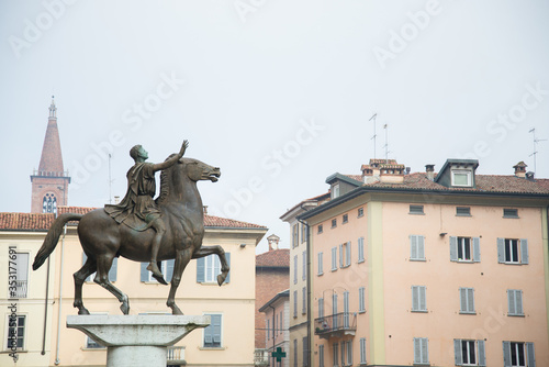 Equestrial statue in front of a cathedral  - Regisole statue, Pavia Cathedral, Italy photo