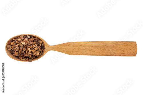 Dried oak bark in a wooden spoon on a white background. Phytotherapy and disease prevention. Herbal collection for medicinal tinctures. Herbal tea in folk medicine. The view from the top