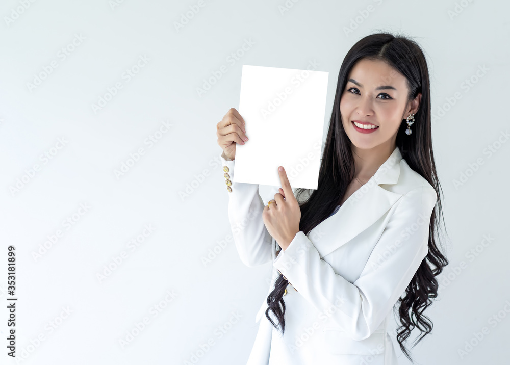 Portrait Call Center Operator woman wearing a telephone headset showing blank signboard with copy space area isolated on grey background.. Portrait Call Center Operator woman wearing a telephone headset showing blank signboard with copy space area isolated on grey background..