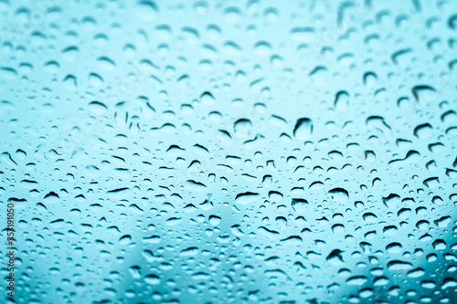 Water drops on the glass. Fogged glass in winter.
