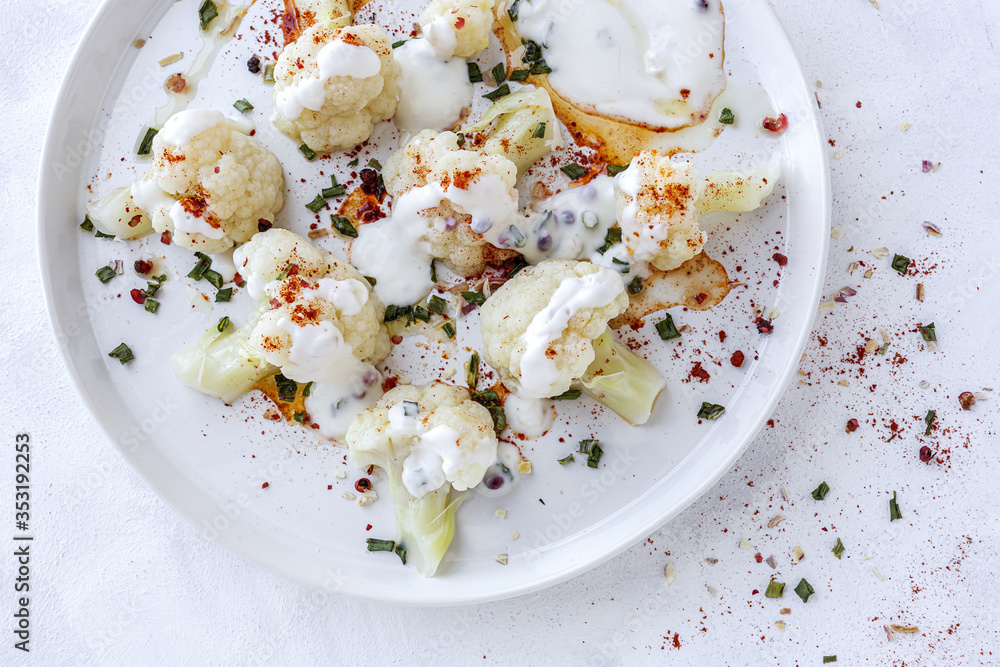 Cauliflower salad with spices and olive oil from above Cauliflower salad with spices and olive oil from above