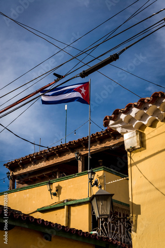 Cuban flag the colonial era centre of the town, Trinidad, Cuba