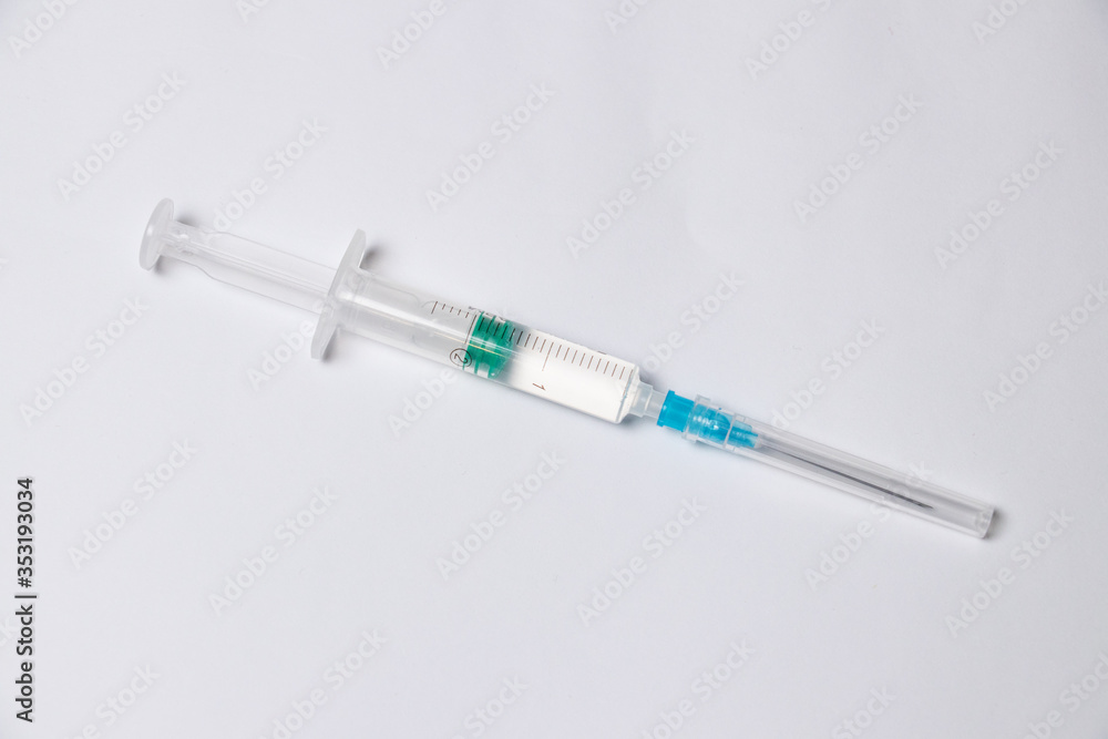 Parts of medical syringe isolated on white background. Needle, syringe barrel with plunger, dosage scale. Parts of medical syringe isolated on white background. Needle, syringe barrel with plunger, dosage scale.