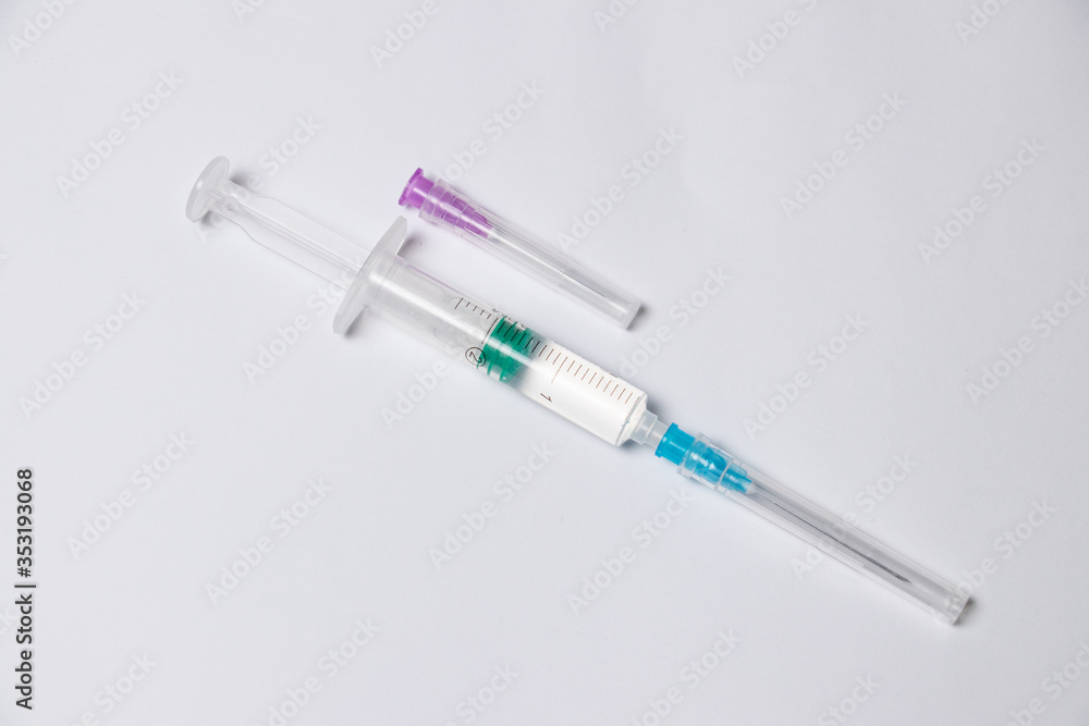 Parts of medical syringe isolated on white background. Needle, syringe barrel with plunger, dosage scale. Parts of medical syringe isolated on white background. Needle, syringe barrel with plunger, dosage scale.