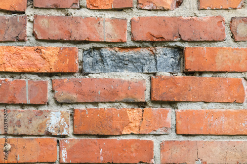 old crumbling abandoned brick wall. close up view
