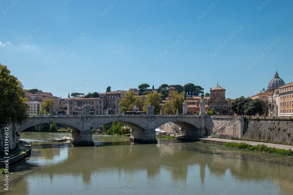 Obraz premium Bridge in Rome with St. Peter's Basilica in the background. Rome is the capital of Italy and the Lazio region. Fantastic story and mythology. 