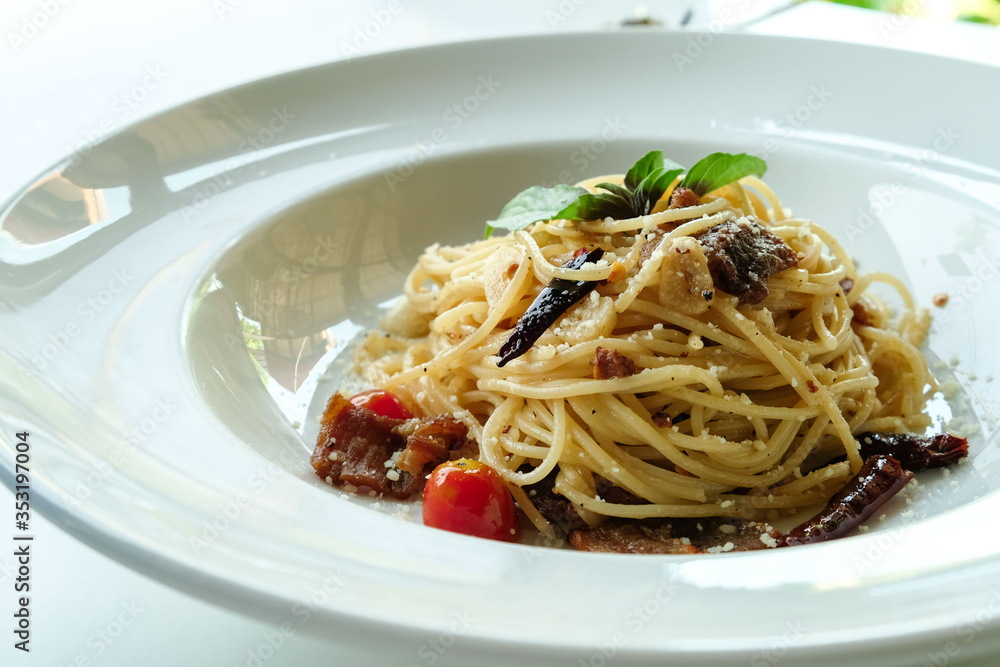 close-up chilli and basil spaghetti,fusion food ,Italian Thai style.background