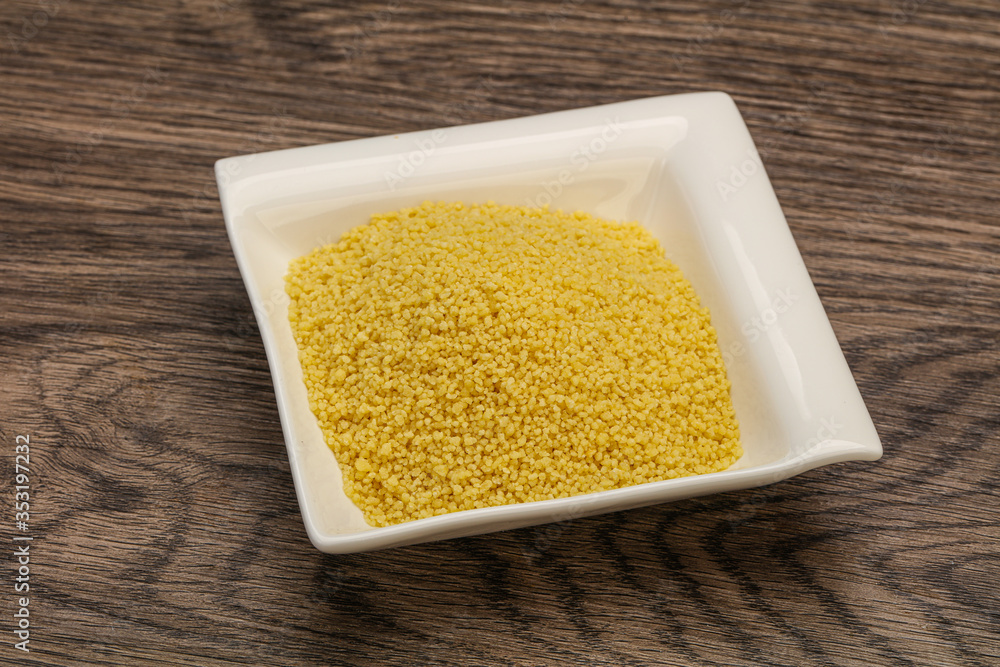 Raw cous cous heap in the bowl Raw cous cous heap in the bowl