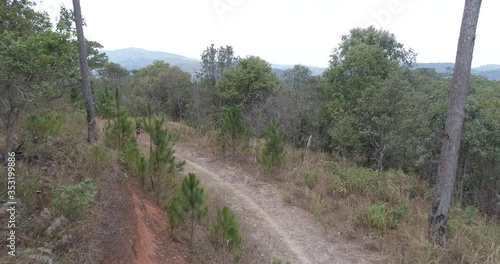 February 2019, aerial view of athletes running on mountain trail path in Dalat