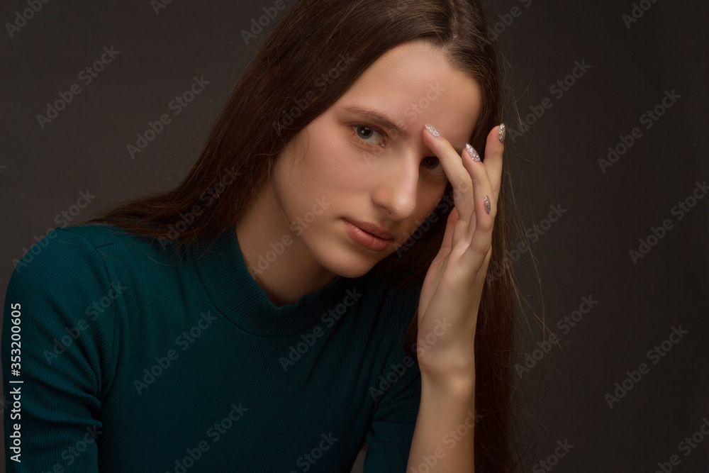 Studio portrait of a young girl with long hair on black background Studio portrait of a young girl with long hair on black background