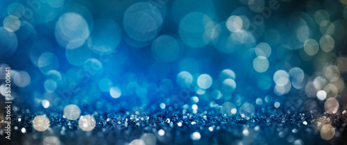 Christmas light background.  Holiday glowing backdrop. Defocused Background With Blinking Stars. Blurred Bokeh.